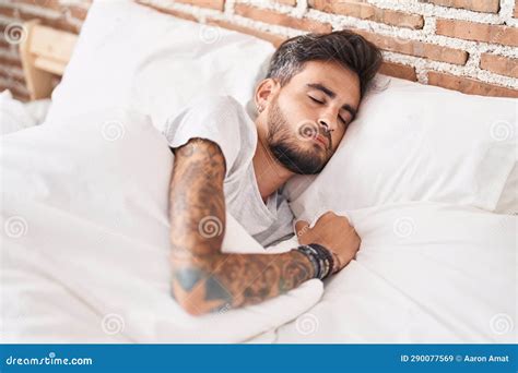 Young Hispanic Man Lying On Bed Sleeping At Bedroom Stock Image Image