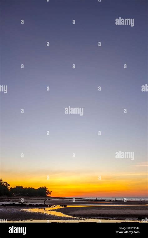 Nightcliff Beach At Sunset With People Silhouettes In A Suburb Of