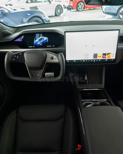 Vertical Shot Of The Dashboard Of A Tesla Model S Plaid Steering Yoke