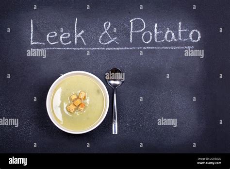 Chalkboard Advertising The Soup Of The Day With A Bowl Of Leek And