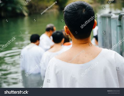 Unidentified Christian Pilgrims During Mass Baptism Stock Photo