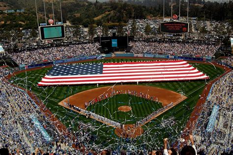 Download A Baseball Stadium With An American Flag Wallpaper ...