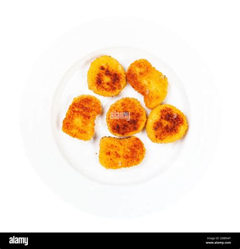 Top View Of Portion Of Fried Chicken Nuggets On White Plate Isolated On