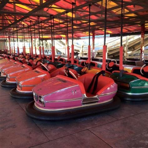 Several Bumper Cars Are Lined Up In A Row