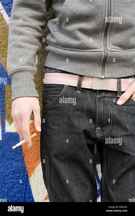 Teenage boy smoking Stock Photo - Alamy