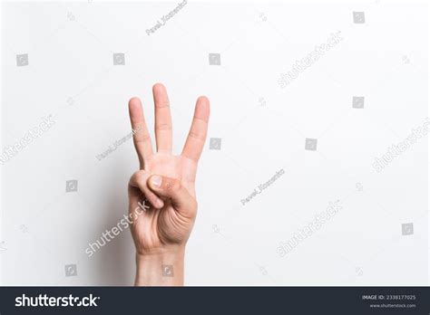 Holding Up 3 Fingers Photos And Images Shutterstock