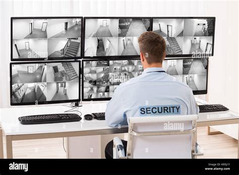 security guard monitoring multiple cctv footage stock photo alamy