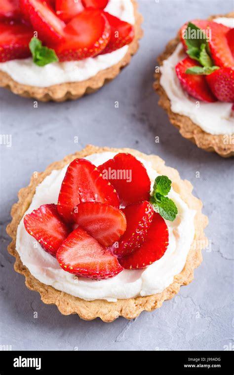 Strawberry Vanilla Cream Cheese Tarts Over Light Gray Background Stock