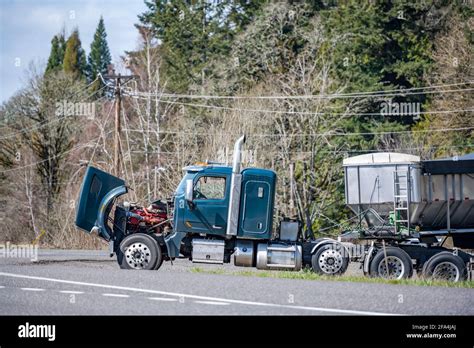 Broken Industrial Big Rig Semi Truck Tractor With An Open Hood And