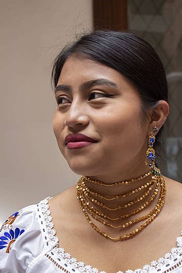 Smiling Indigenous Woman In Traditional Clothing Side Gaze Photo