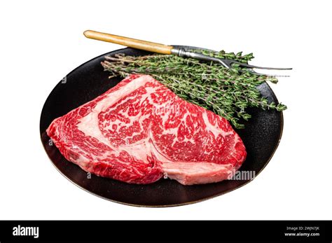 Black Angus Rib Eye Steak Raw Marbled Beef Meat With Herbs Isolated