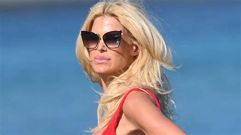Victoria Silvstedt Shows Off Her Gym Honed Figure In A Red Bikini As She Tops Up Her Tan On The