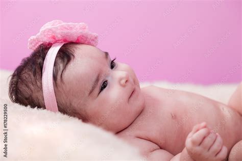 Cute Pretty Happy Chubby Baby Girl Portrait Smiling With A Big Smile Lying Naked Or Nude On