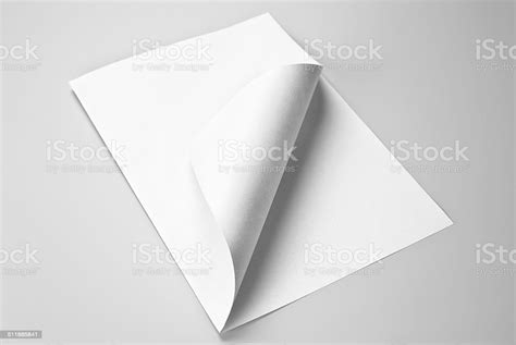 Blank Folded Sheet Of Paper With Curled Corner Stock Photo Download