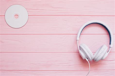 White Music Headphones on Pink Background