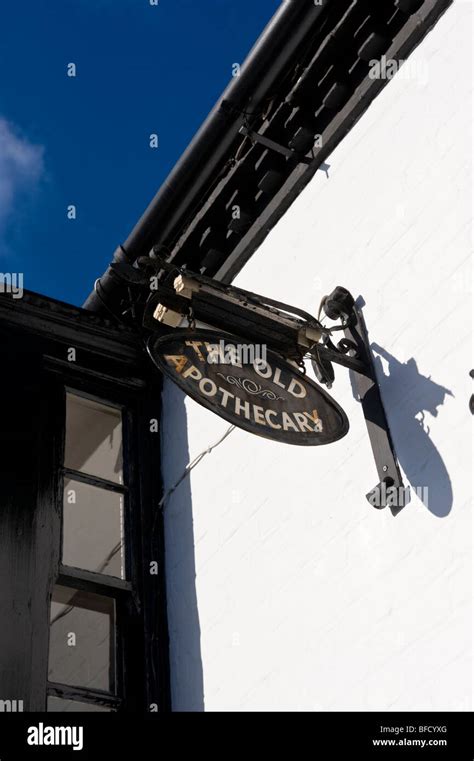 A Traditional Hanging Shop Sign On A Building At High Street Cookham