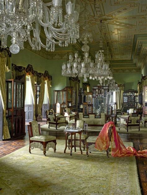 an ornately decorated room with chandeliers and chairs