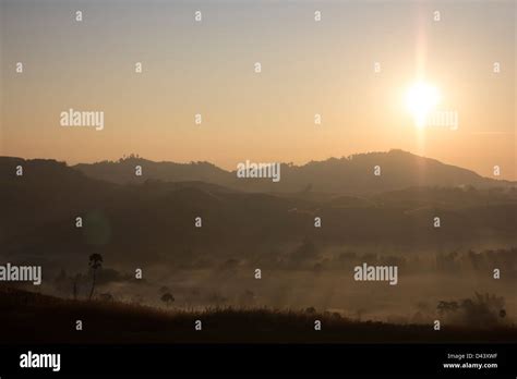 Sunrise with foggy misty in natural landscape Stock Photo - Alamy