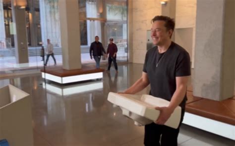 Styling Himself Chief Twit Elon Musk Enters Twitter Hq Ahead Of