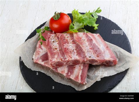 Raw Pork Ribs With Herbs And Spices Stock Photo Alamy