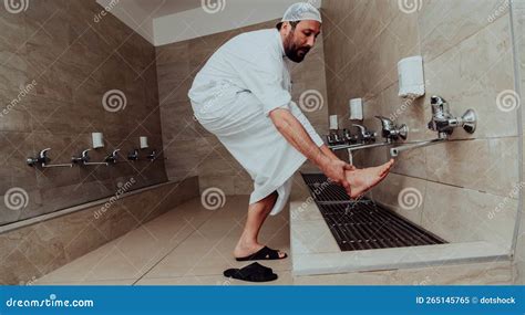 A Muslim Performing Ablution Ritual Religious Cleansing Of Muslims