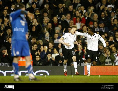 Fulham's Damien Duff (centre) celebrates scoring his team's opening ...