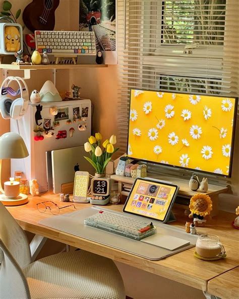 A Desk With A Computer Keyboard And Flowers On It