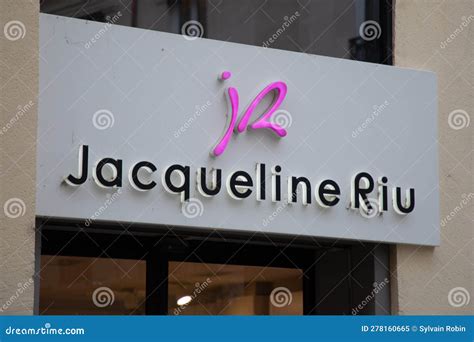 Jacqueline Riu Logo Brand and Text Sign on Wall Facade Shop Entrance in ...