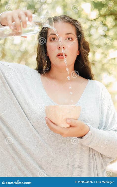 Woman Pouring Water Into Decorative Pink Bowl Stock Photo Image Of