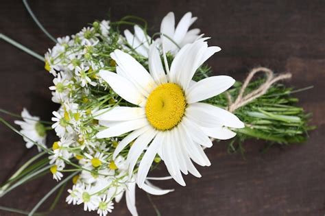 Premium Photo Beautiful Bouquet Of Daisies On Wooden Background