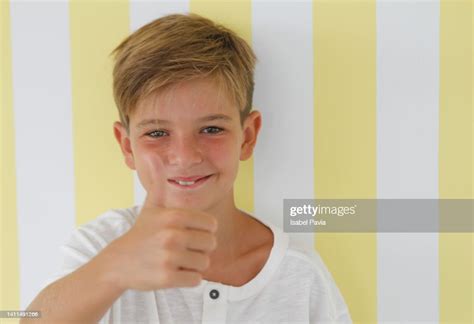 Kid Showing Thumbs Up High-Res Stock Photo - Getty Images