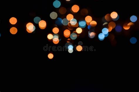 Abstract Blurry Small Light Glowing In The Dark Night Background Stock