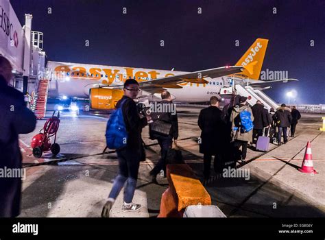 Paris, France, Passengers People Boarding Outside to AirPlane at Night ...