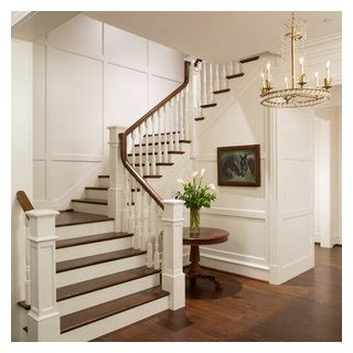 Elegant Foyer Stair Wraps A Paneled Two Story Entry Hall Traditional