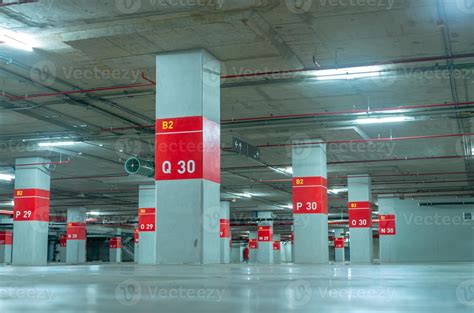 Empty underground car parking lot. Underground car parking garage at