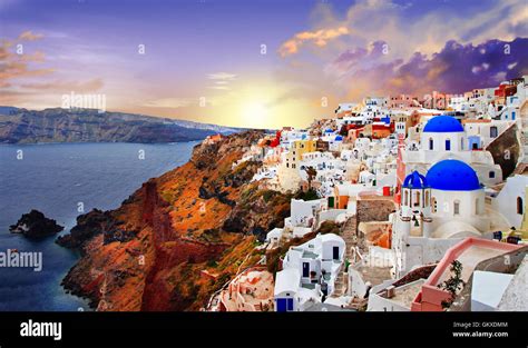 Santorini sunset, view of Oia village and caldera Stock Photo - Alamy