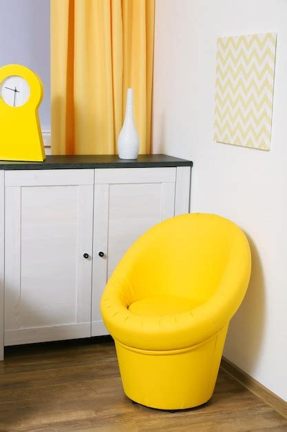 Premium Photo | Yellow modern chair in the room