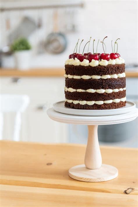 Summer Dessert With Cherries Naked Chocolate Cake On The Kitchen Table Holiday Concept Happy