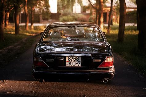 Grayscale Photo of a Black Sports Car Convertible · Free Stock Photo