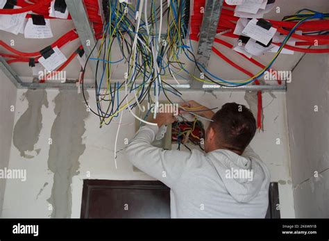 electrician worker hands install electrical  res stock photography