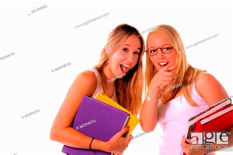 Two Blond High School Senior Girls Hanging Out And Sharing The Local