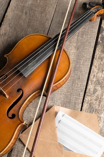 Premium Photo Sheet Music And Violin On Wooden Table