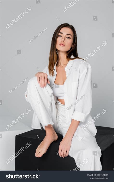 Brunette Barefoot Woman Sitting On Black Stock Photo Shutterstock