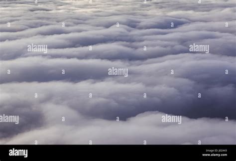 Clouds seen from plane window Stock Photo - Alamy