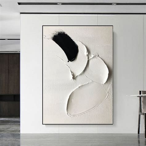 An Abstract Painting Hangs On The Wall Next To A Dining Room Table With