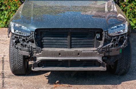 Mask Of A Dusty Modern Black Suv Car Without A Front Bumper Stock Photo