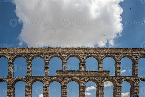 Ancient Roman Aqueduct in Segovia Under a Cloudy Sky 50344607 Stock