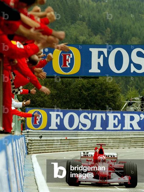 Image Of German Ferrari Driver Michael Schumacher Raises His Fist In