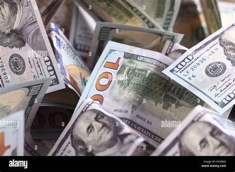 Money background of dollars in cash pile Stock Photo - Alamy