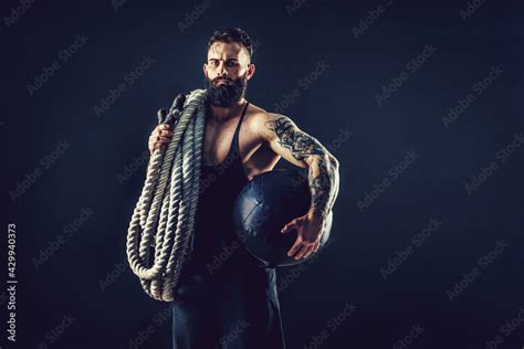 Muscular Man Working Out With Heavy Rope Photo Of Man With Naked Torso